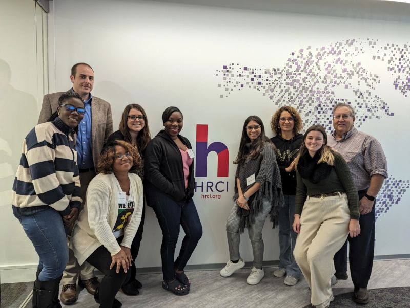 Abigail Ansah and colleagues at an HRCI event and professional group photo